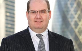 Buy-Side Profile: Darren Bustin, Schroders Solutions